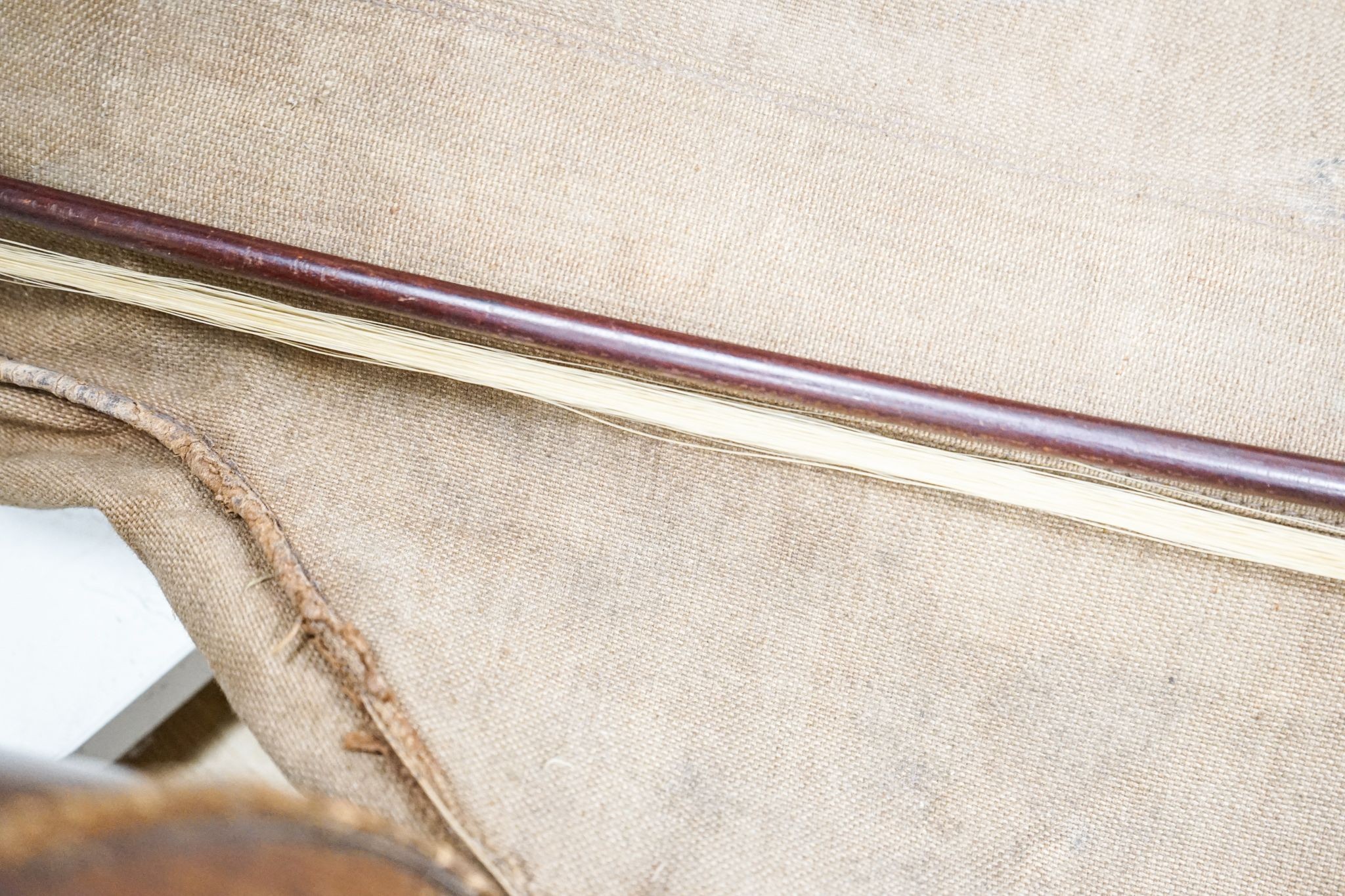 A late 19th century French cello, lob 75.5cm, canvas case with bow